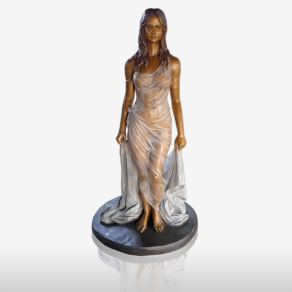 bronze statue of women with skirt