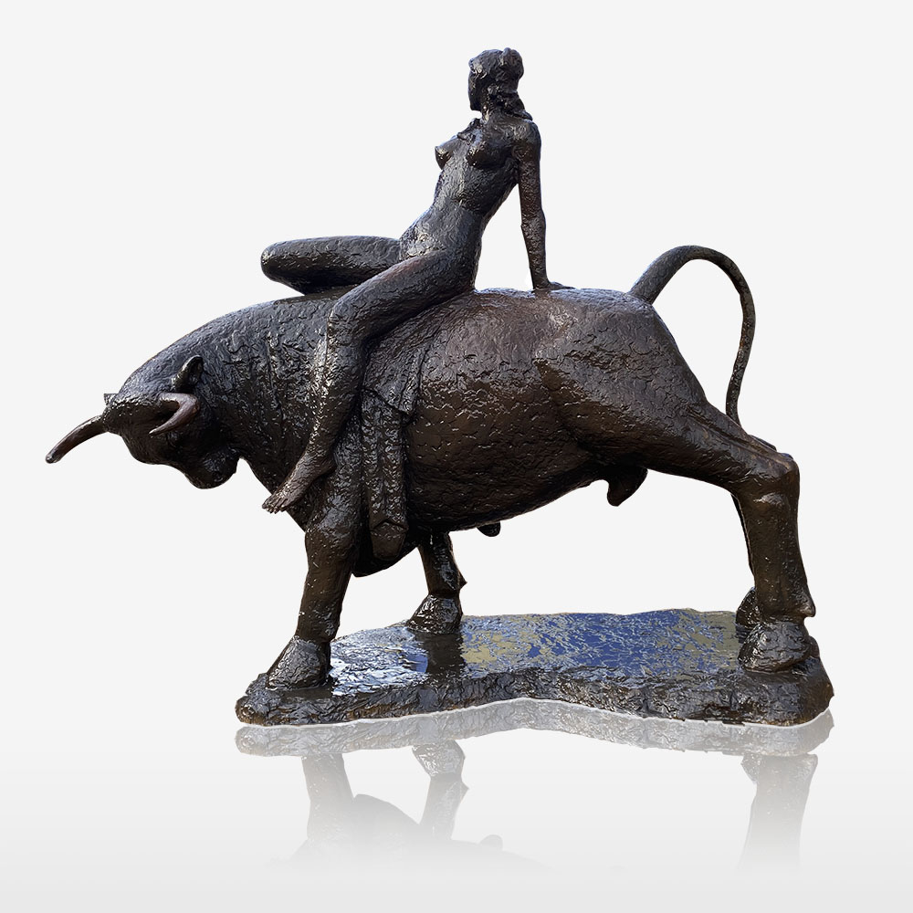 modern bronze sculpture of nude women sitting on a bull