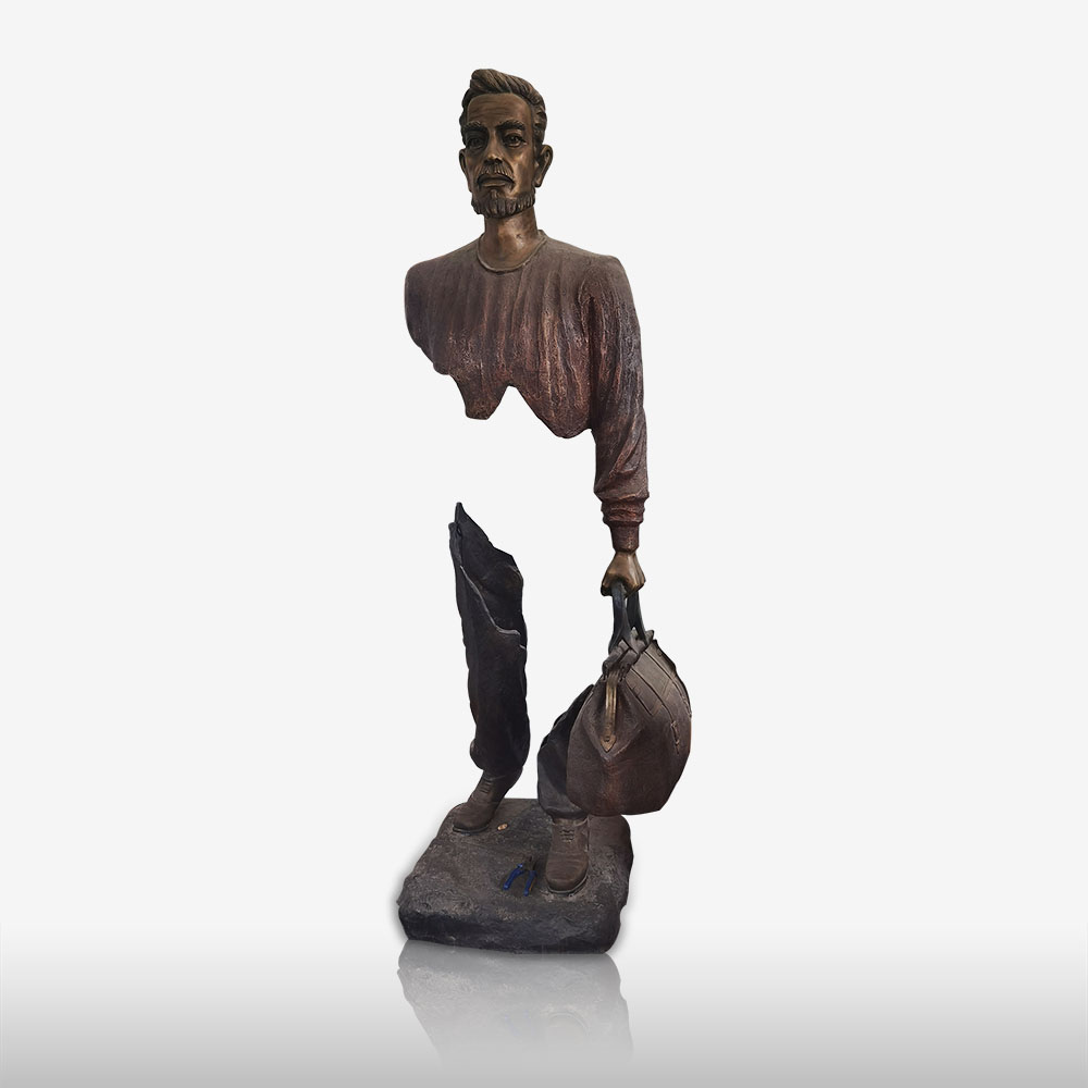 Modern bronze statue of invisible traveller